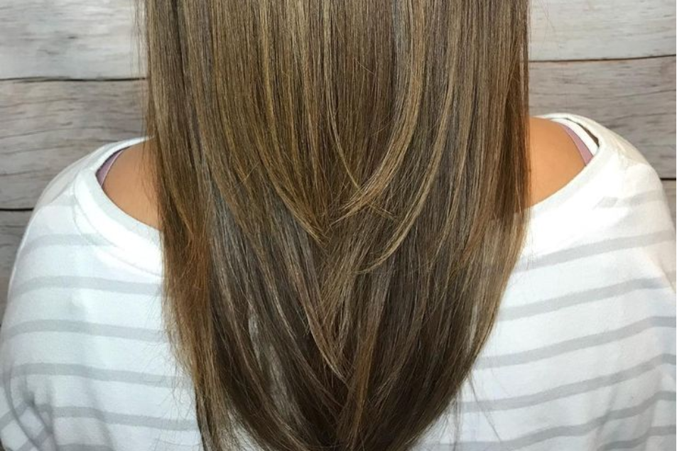 Partial babylights on long straight hair showing natural sun-kissed highlights at Salotto Salon in San Diego