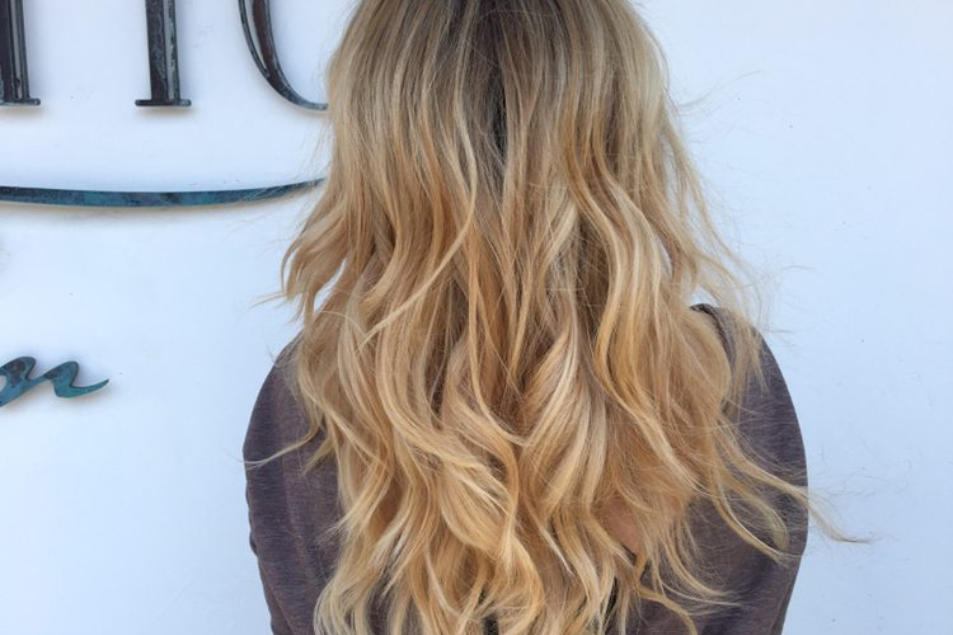 Full blonde balayage at Salotto Salon in San Diego featuring soft golden tones, seamless blend, and natural sun-kissed dimension.