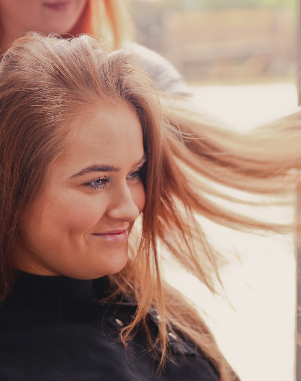 Client enjoying a professional blow-dry and styling session