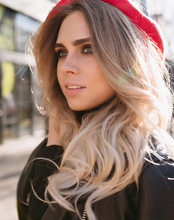 Natural-looking partial foil highlights with soft blonde dimension in San Diego
